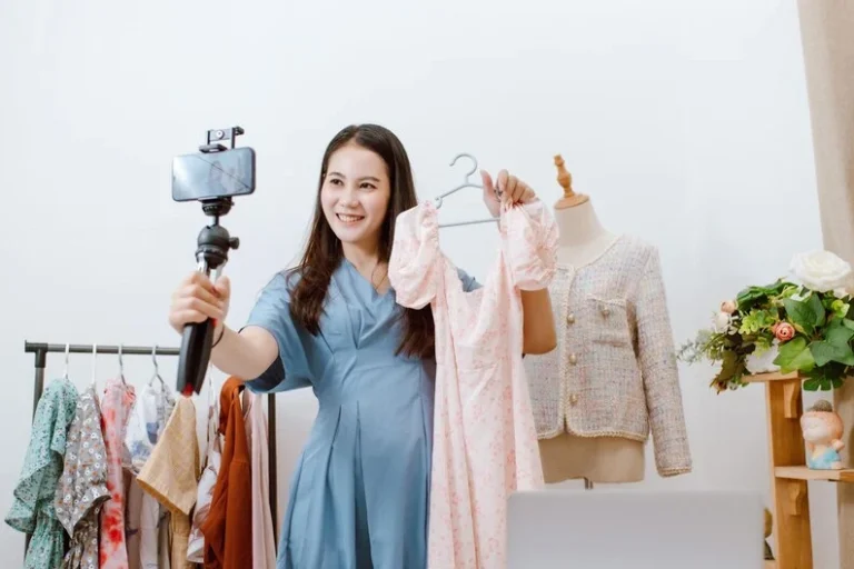 beautiful-asia-woman-live-streaming-selling-clothes-online-with-smartphone-her-shop-small-business-owner-online-market-concept